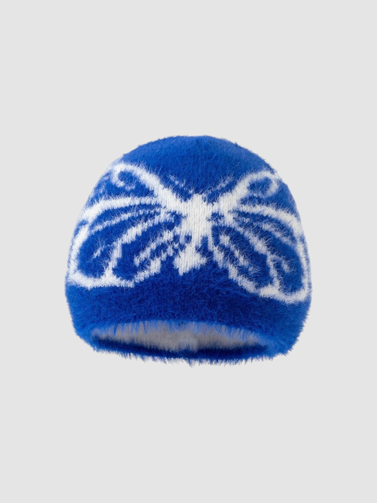 Y2K Avenue fuzzy blue beanie with a white butterfly wing pattern in a soft, plush texture.