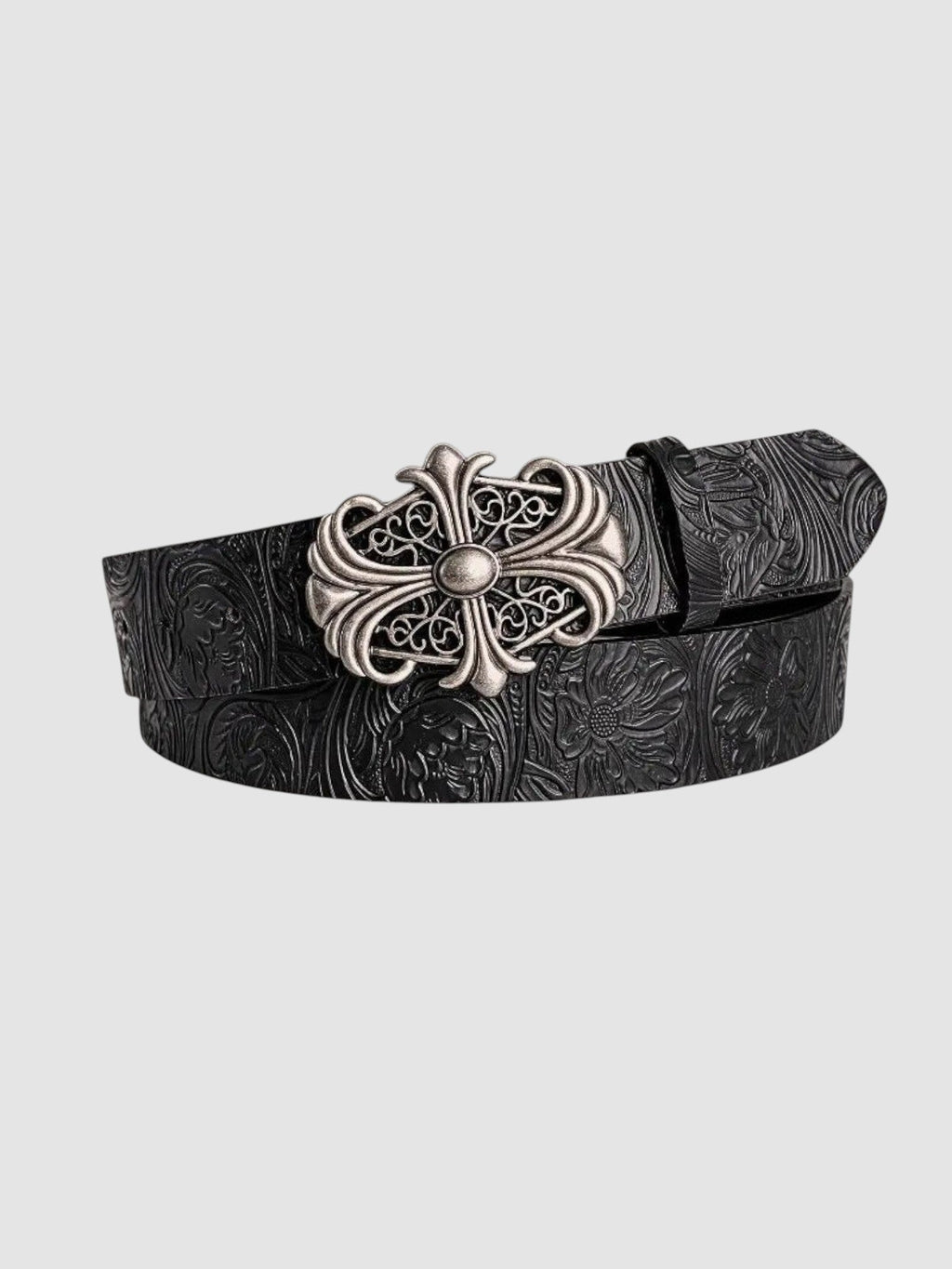 Y2K Avenue black faux leather belt with floral tooling and an ornate silver cross buckle in a gothic rock style.