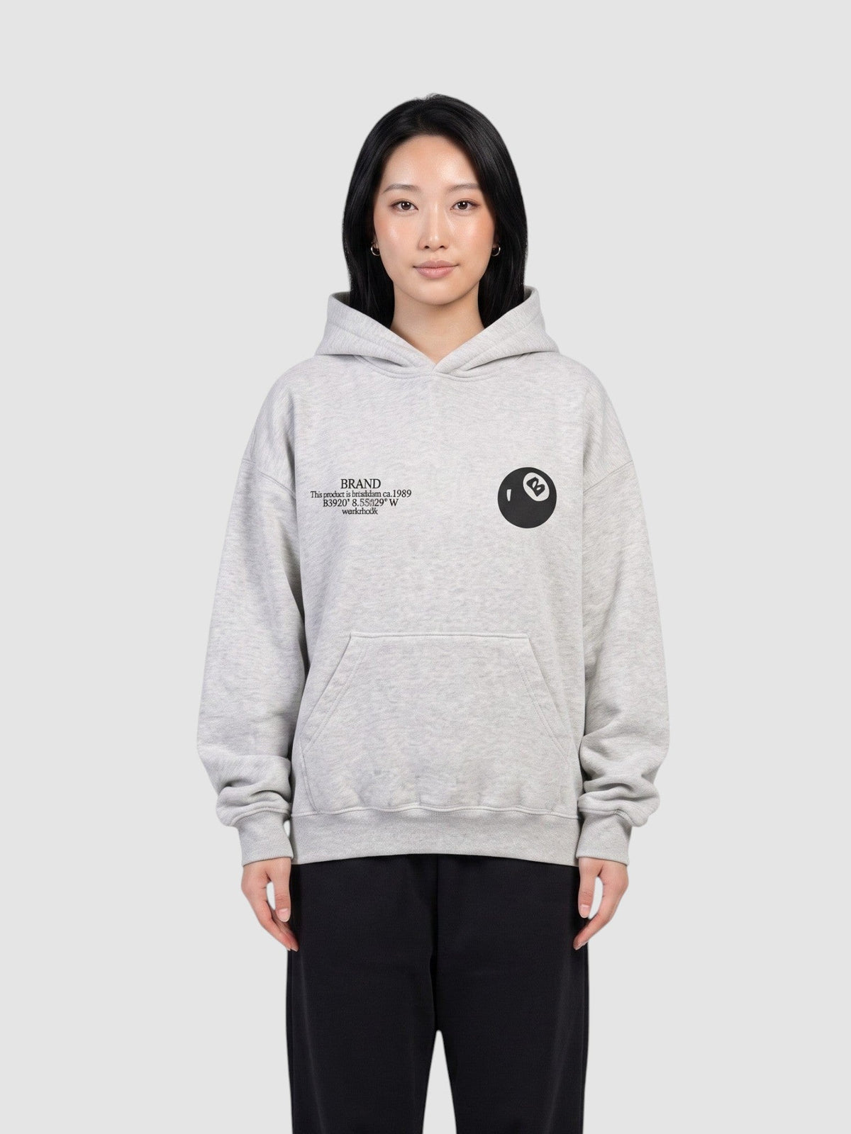 Y2K Avenue grey oversized hoodie with 8 ball logo and chest text, worn by a model against a neutral background.