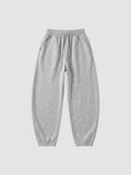 Y2K Avenue grey barrel leg sweatpants with a high elastic waist, drawstring, and deep side pockets.