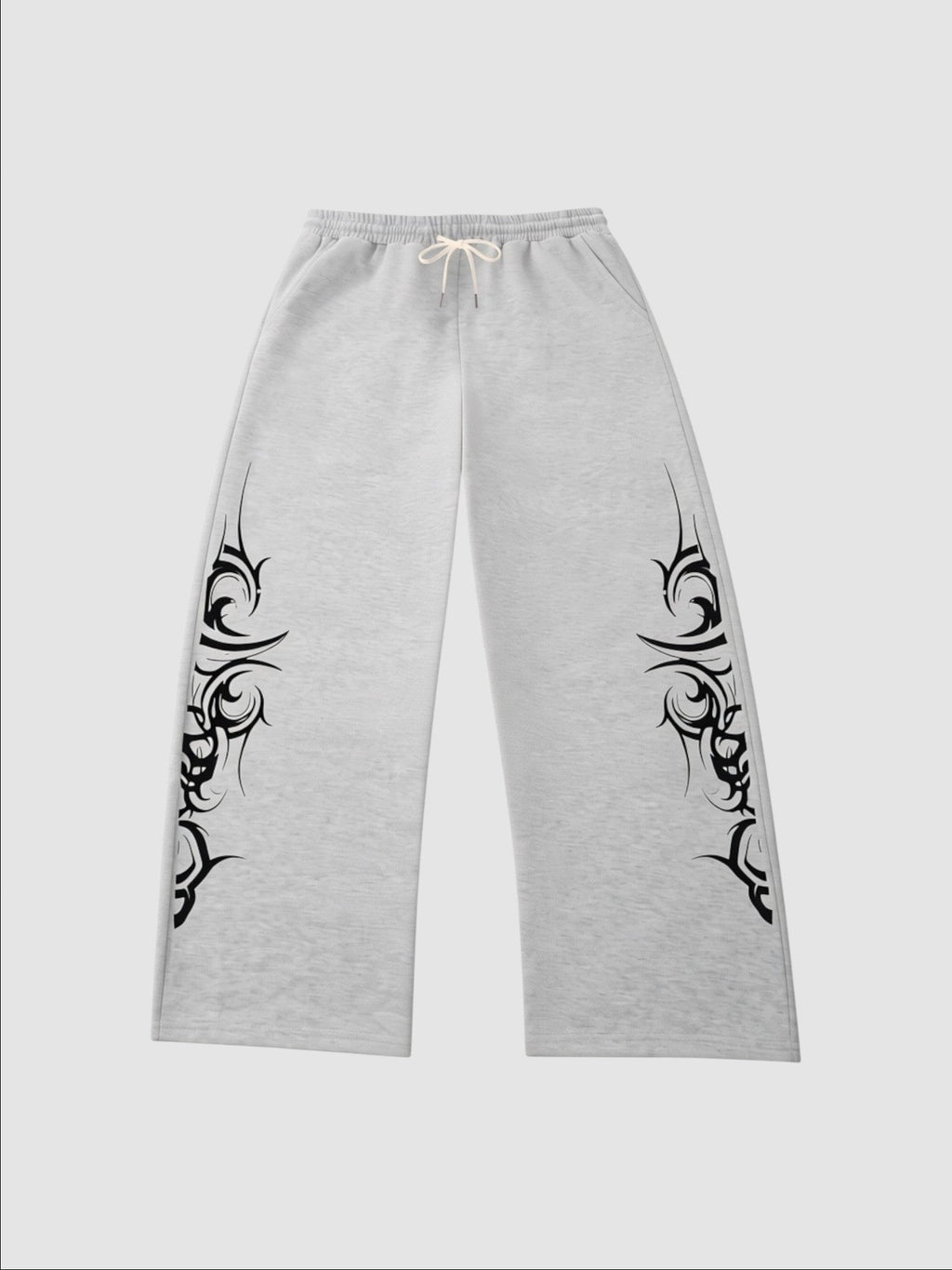 Y2K Avenue grey heather wide-leg joggers featuring black tribal graphic prints on the sides and an elastic waistband.