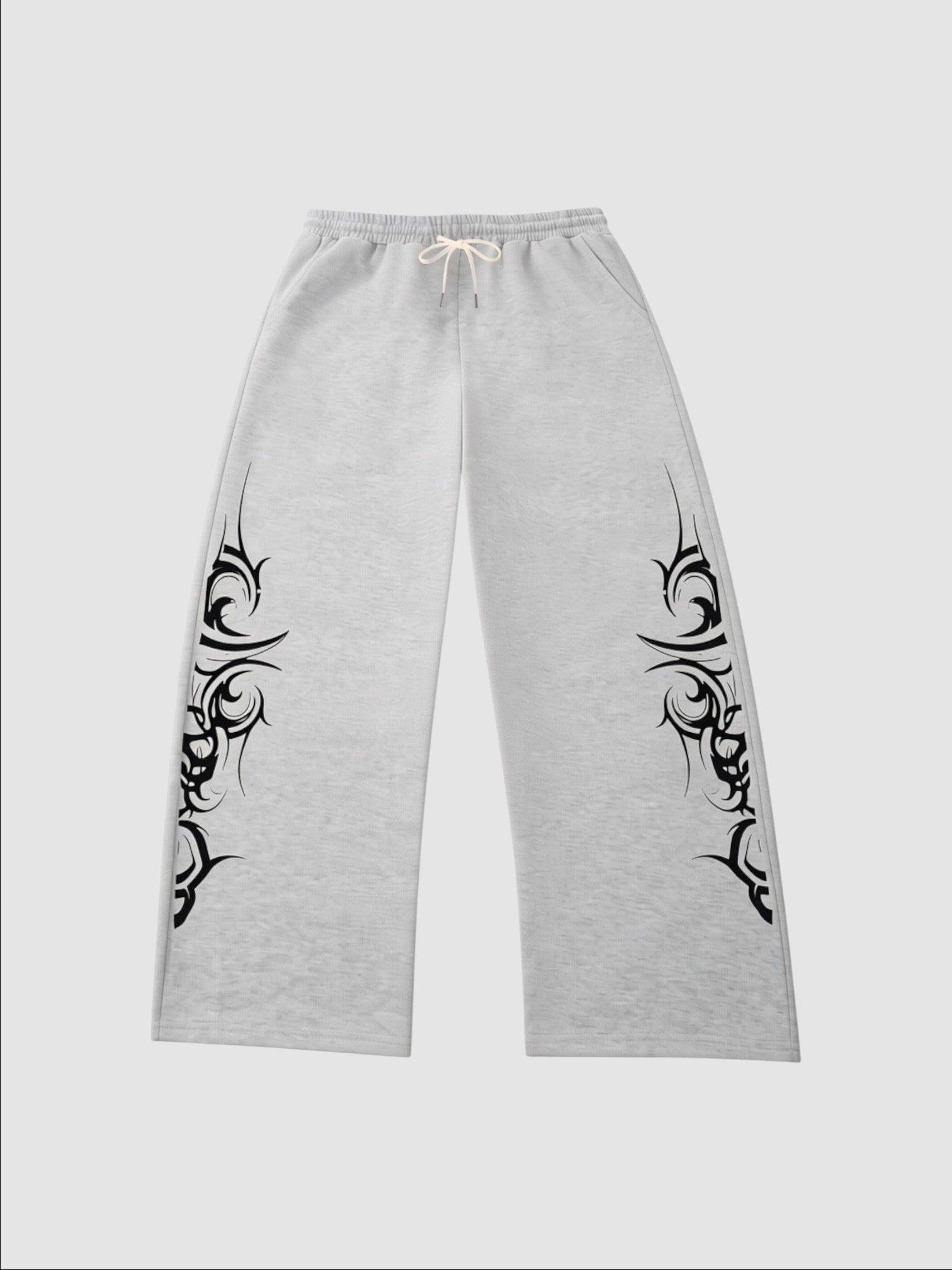 Y2K Avenue grey heather wide-leg joggers featuring black tribal graphic prints on the sides and an elastic waistband.