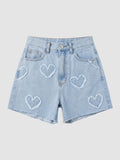 Y2K Avenue high-waisted light blue denim shorts featuring frayed heart appliqués and a raw hem.