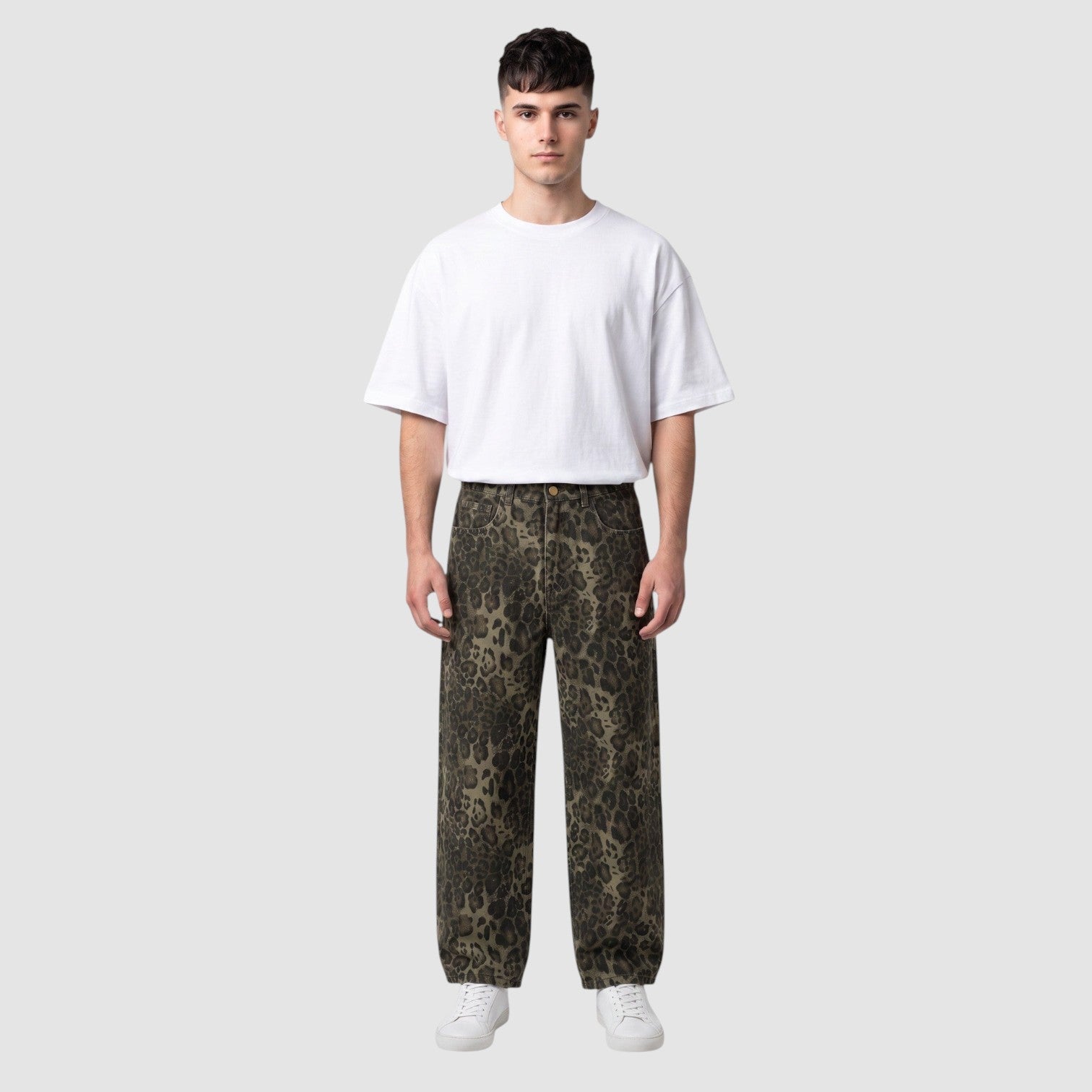 Y2K Avenue baggy leopard print denim jeans with a wide leg fit worn by a male model with a white t-shirt