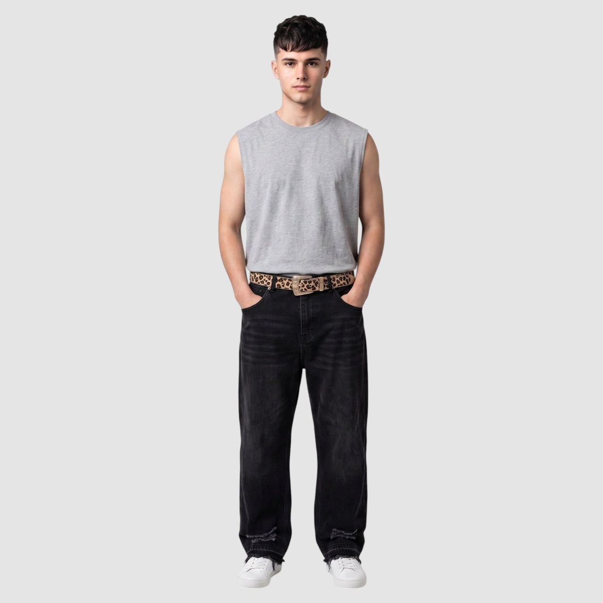 Y2K Avenue leopard print belt with western buckle and silver conchos worn by a man in a grey tank top and black jeans