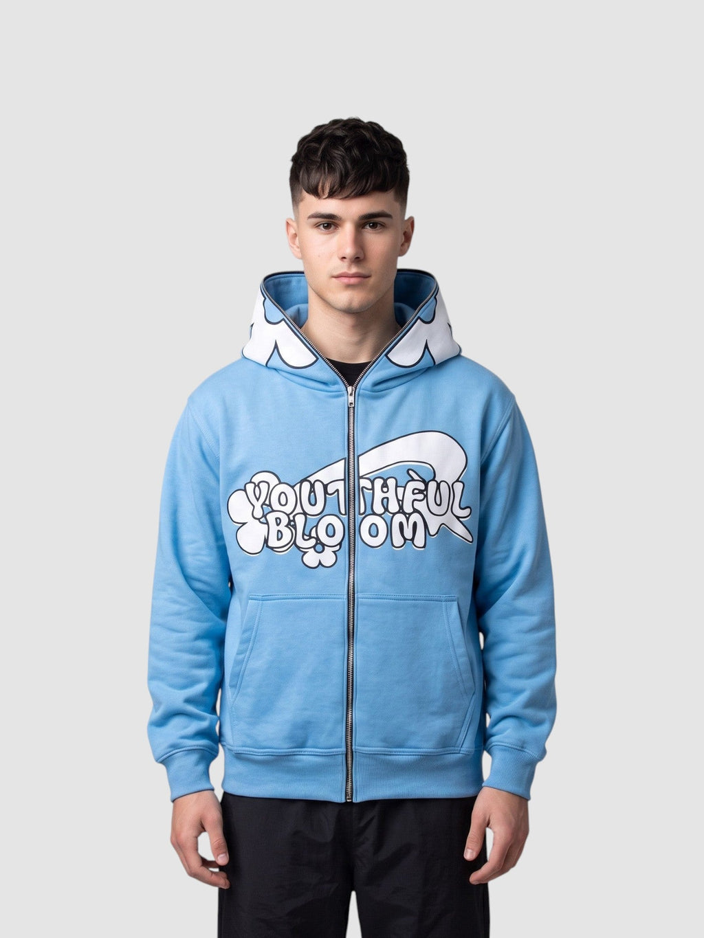 Y2K Avenue light blue zip-up hoodie featuring a large white flower on the hood and bubble lettering graphic on front