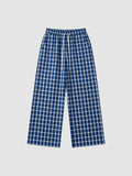 Y2K Avenue wide-leg plaid trousers in navy blue and white with an elasticated drawstring waist and side pockets.