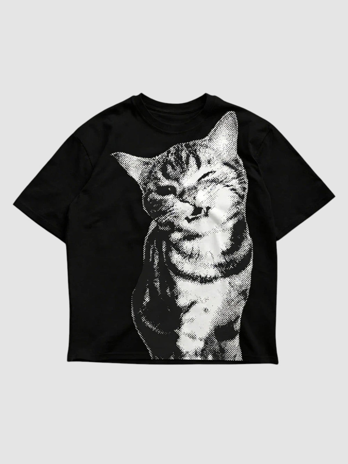 Y2K Avenue oversized black t-shirt featuring a white halftone cat portrait graphic with a winking expression.