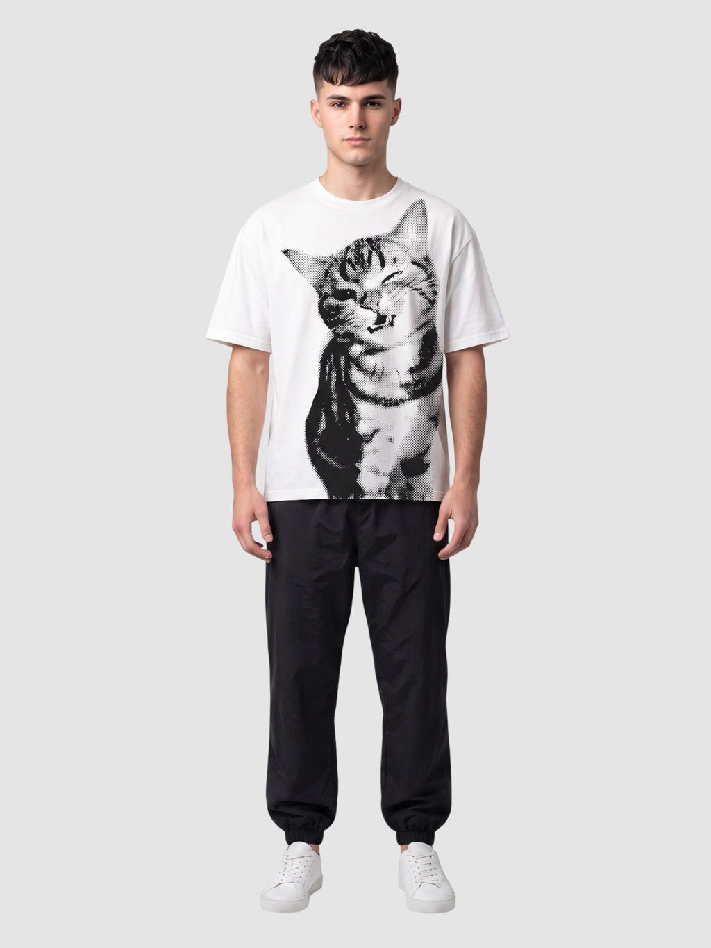Y2K Avenue white oversized t-shirt featuring a black halftone cat portrait print worn by a male model