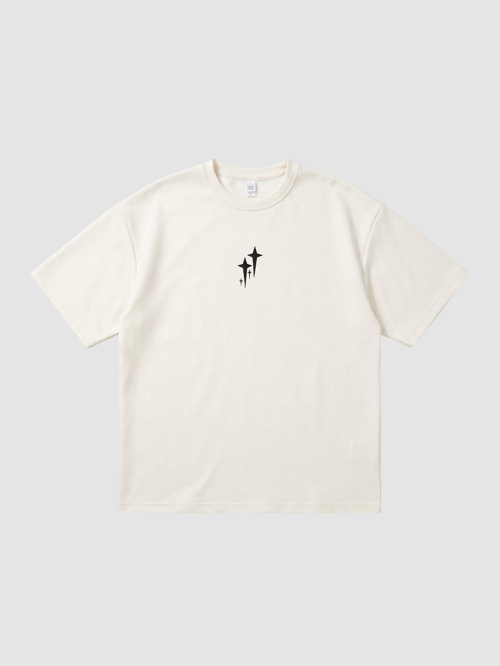 Y2K Avenue oversized cream polyester t-shirt with a small black star graphic on the chest and ribbed crew neck.