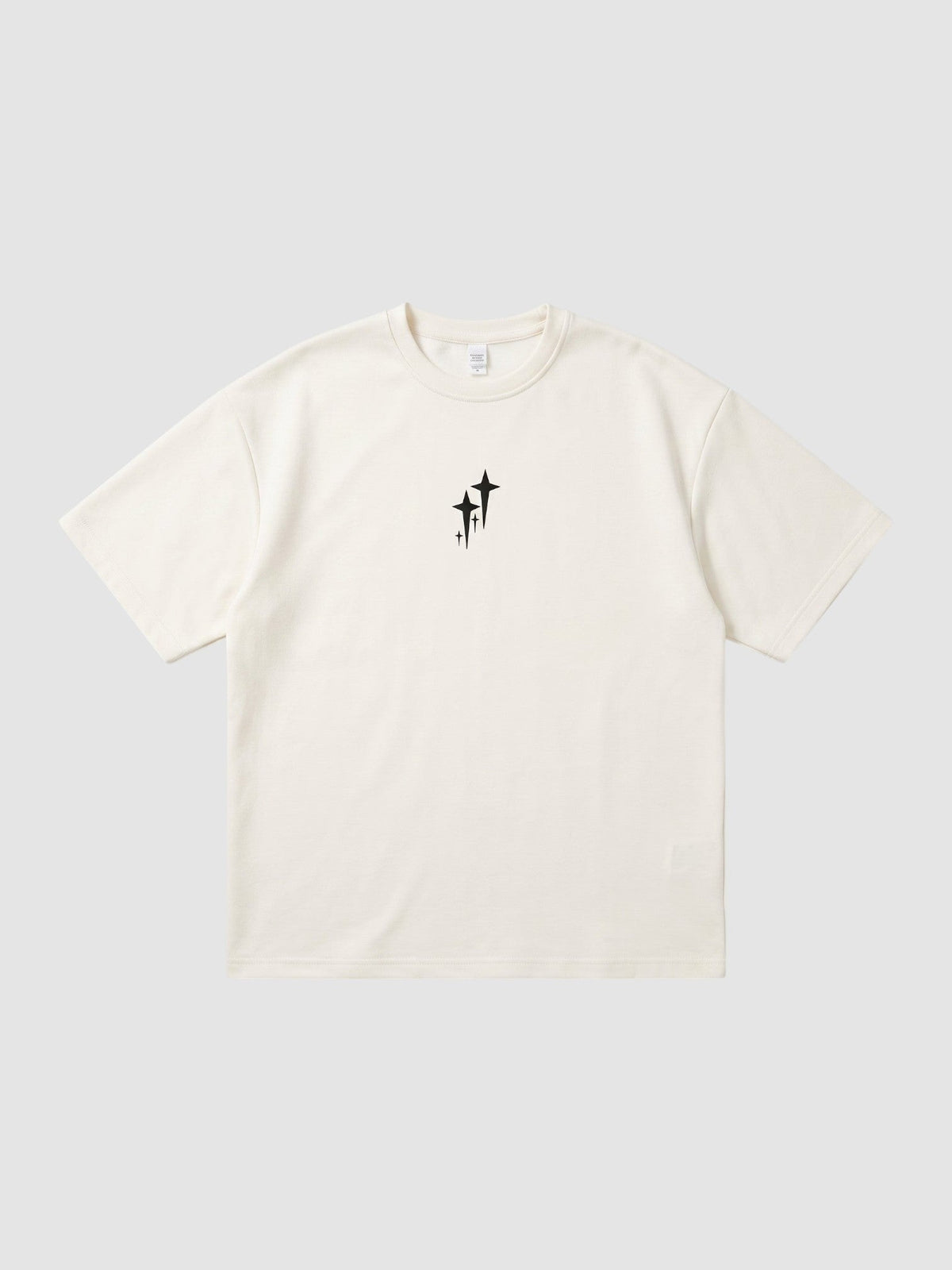 Y2K Avenue oversized cream polyester t-shirt with a small black star graphic on the chest and ribbed crew neck.
