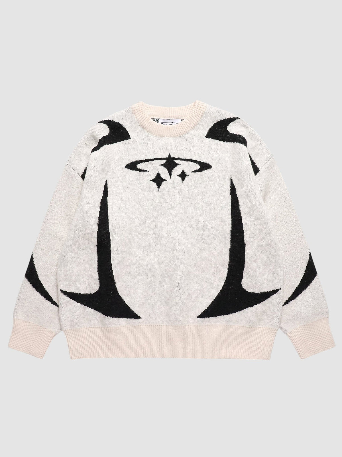 Y2K AVENUE oversized knit sweater in cream with black star and curved graphic patterns and ribbed crew neck