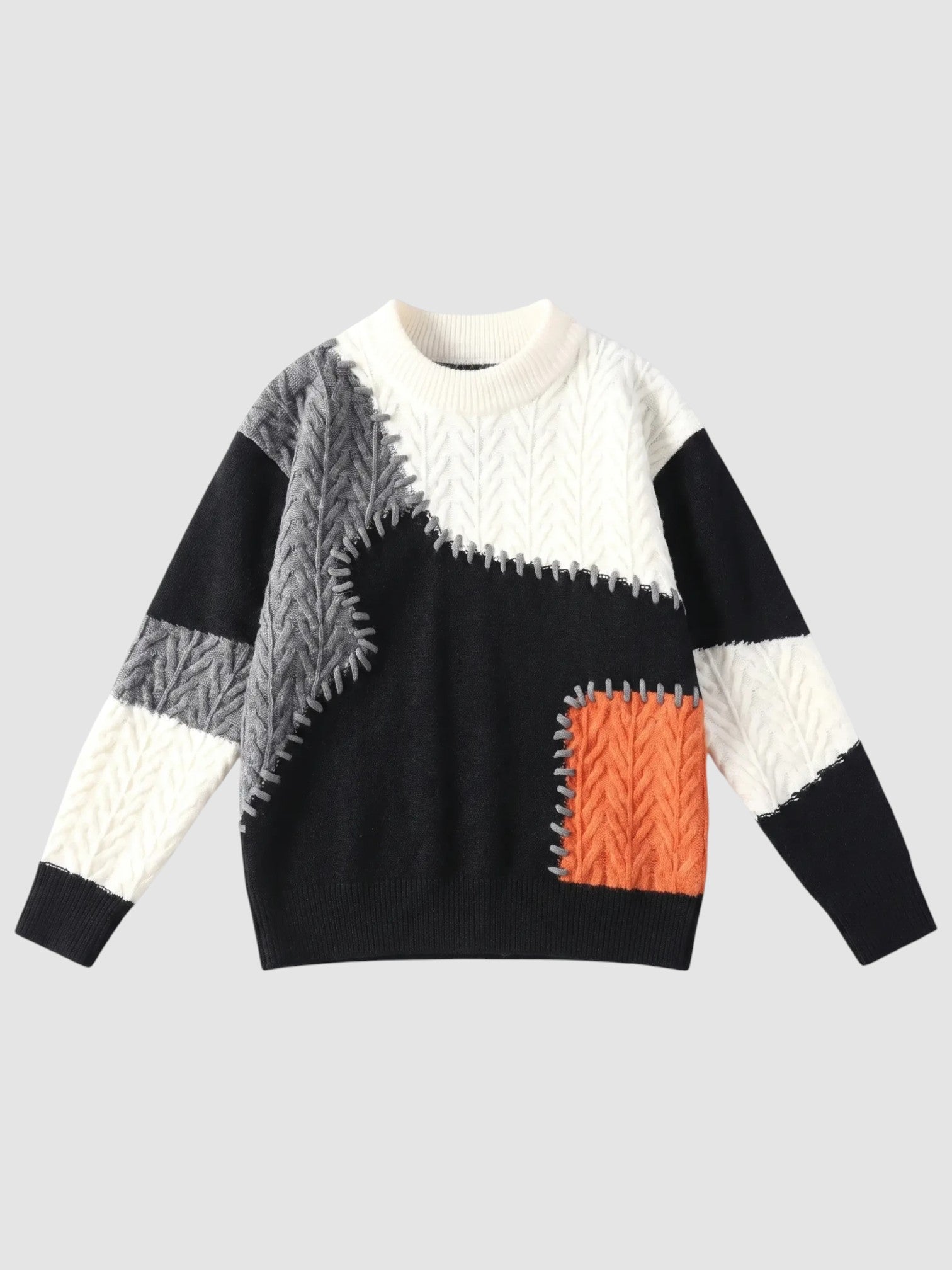Y2K Avenue patchwork knit sweater featuring off-white, black, and orange textured panels with decorative whipstitching.