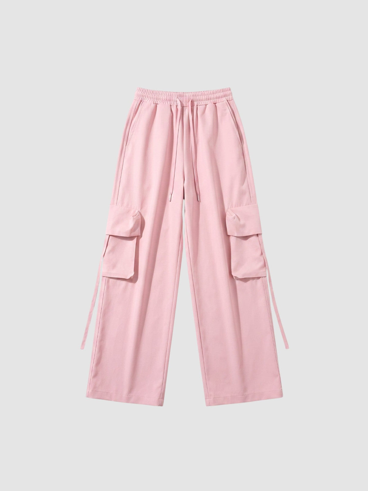 Y2K Avenue powder pink parachute cargo pants with wide legs, elastic waist, drawstring, and side flap pockets.