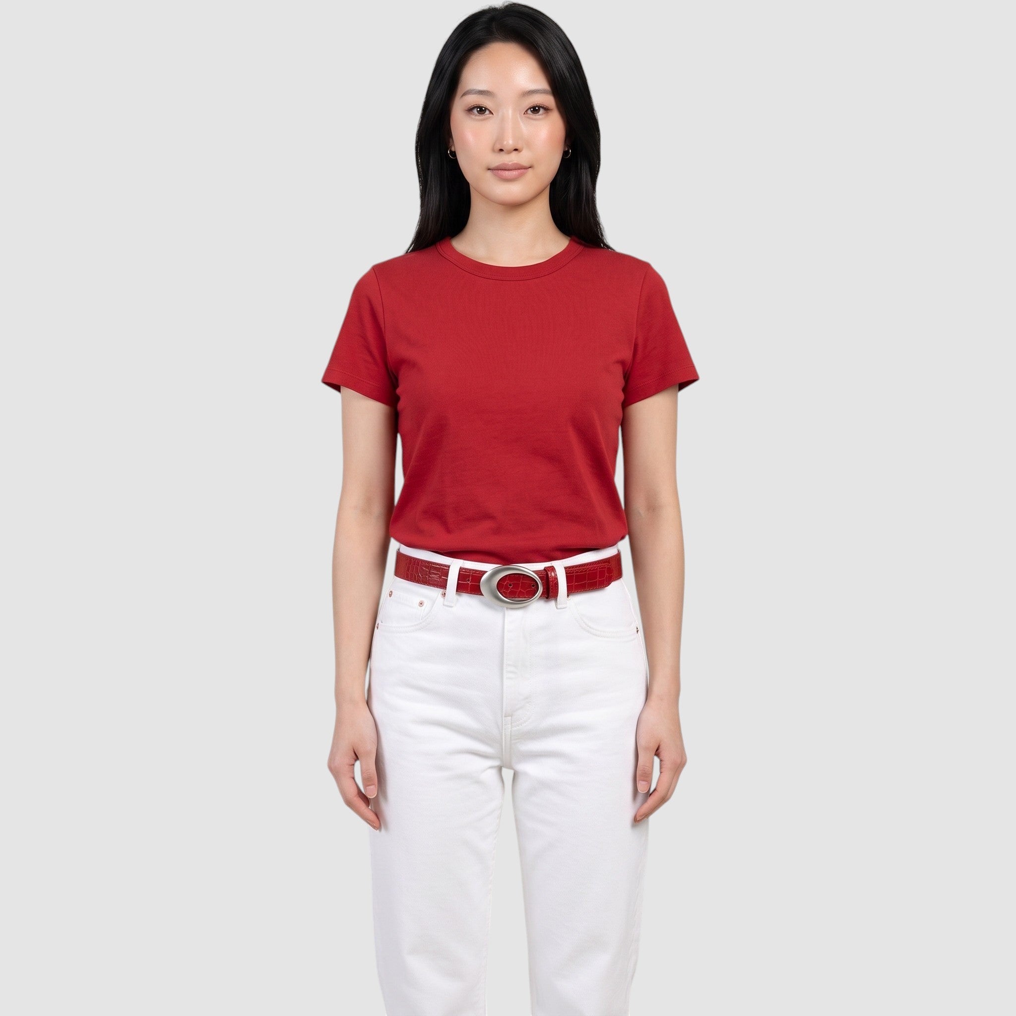 Y2K AVENUE red faux crocodile leather belt with a silver oval buckle worn by a model in a red t-shirt and white jeans