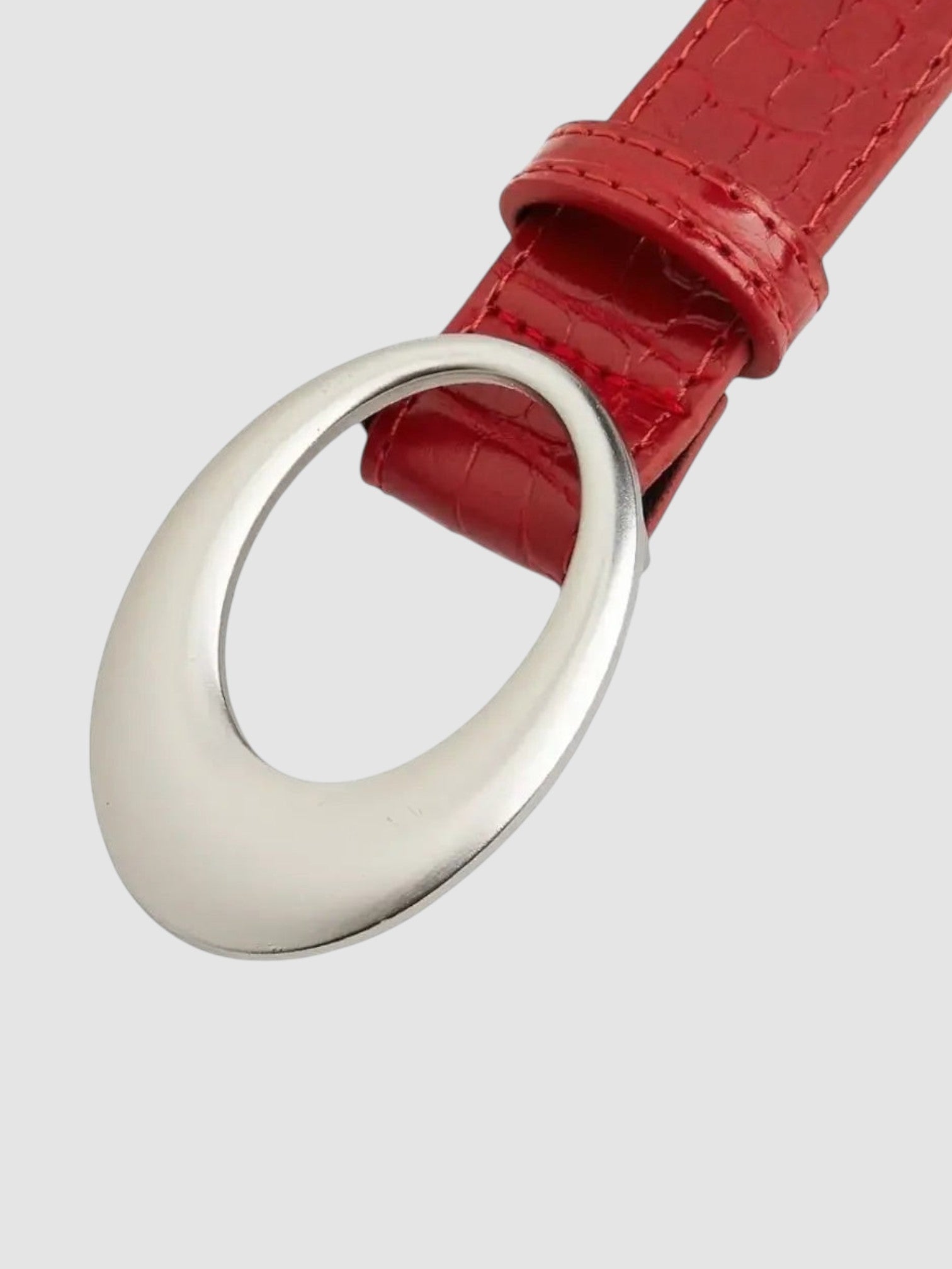 Y2K Avenue red faux crocodile leather belt with a large polished silver oval buckle