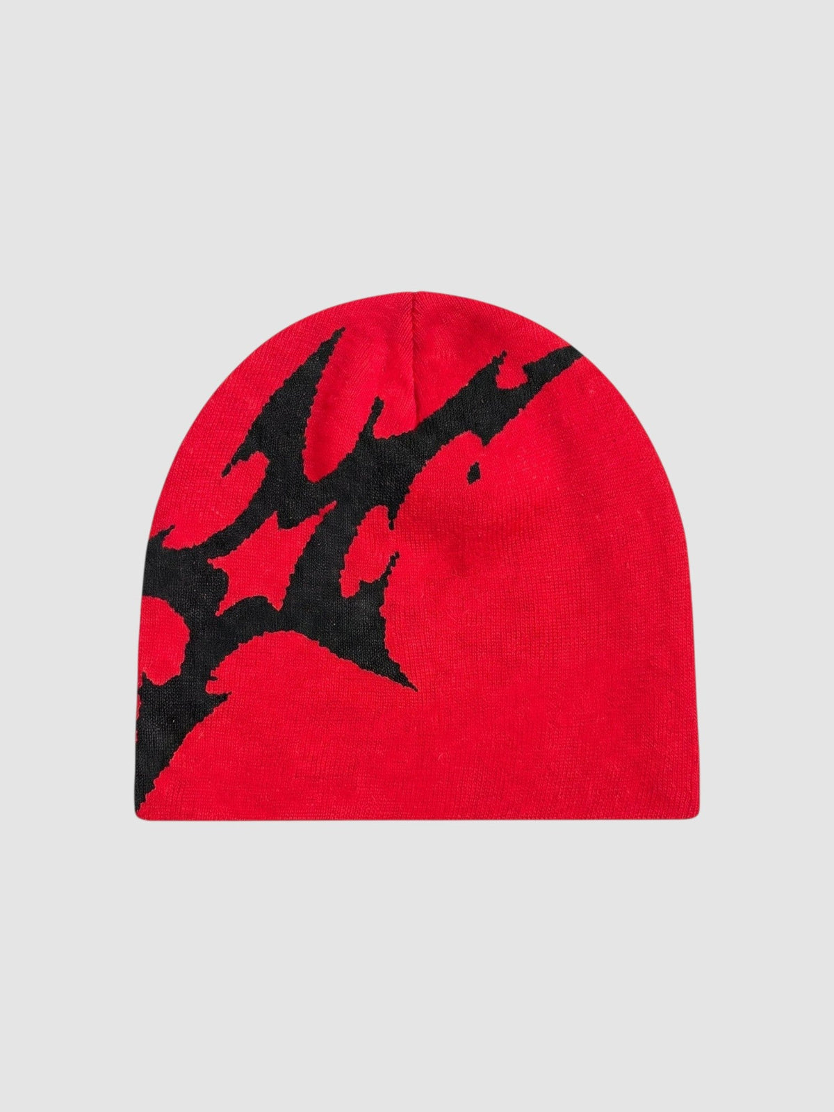 Y2K Avenue red acrylic beanie with an asymmetrical black lightning bolt graphic pattern in a Y2K streetwear style.