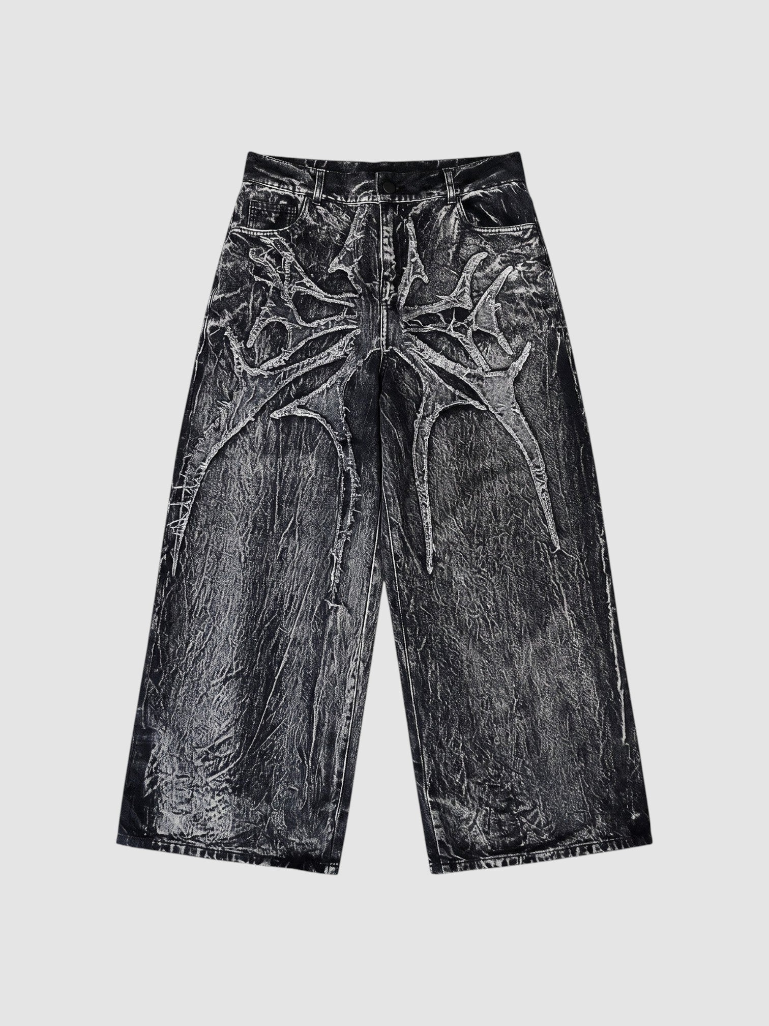 Y2K Avenue wide-leg denim jeans in acid wash black and grey with raw-edge spiderweb fabric appliqués.
