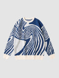 Y2K AVENUE long-sleeve knit sweater featuring a navy blue and off-white spiral swirl pattern with ribbed trim.