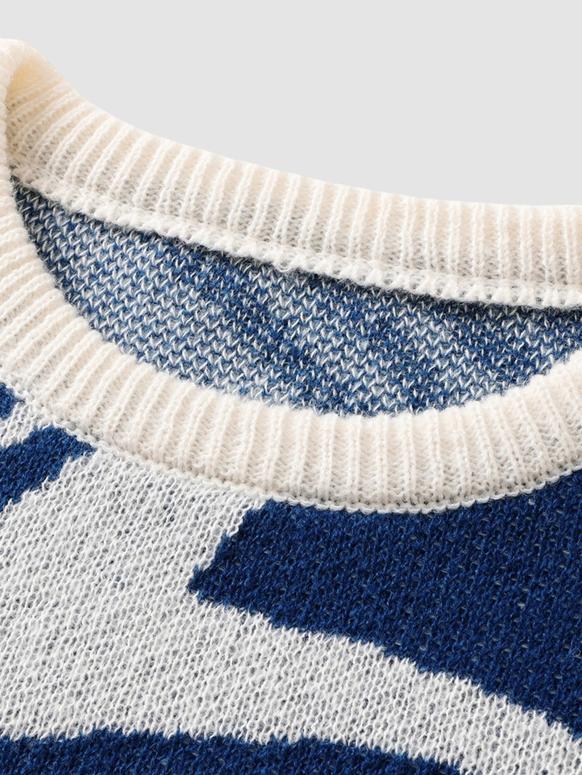 Y2K AVENUE navy and off-white spiral pattern knit sweater with a ribbed crew neck collar