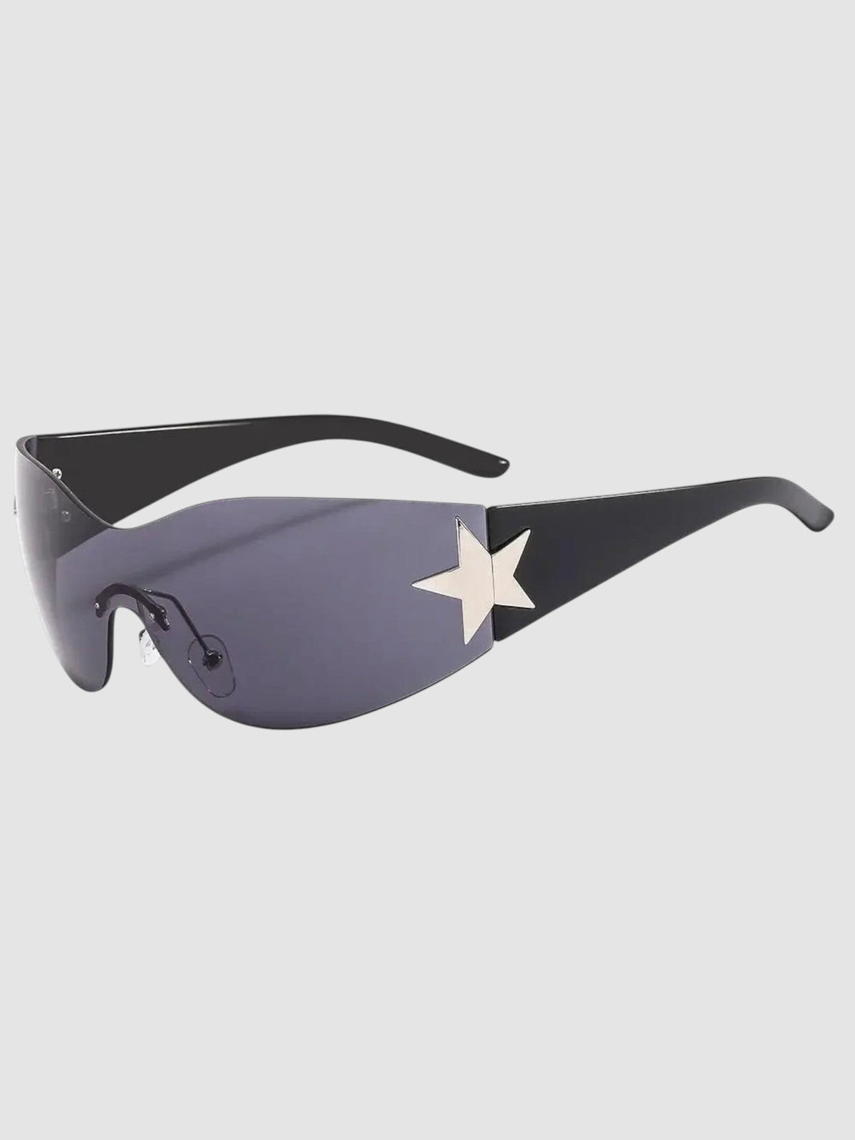 Y2K Avenue star mask sunglasses with a frameless black visor lens and silver star detail on the temple.
