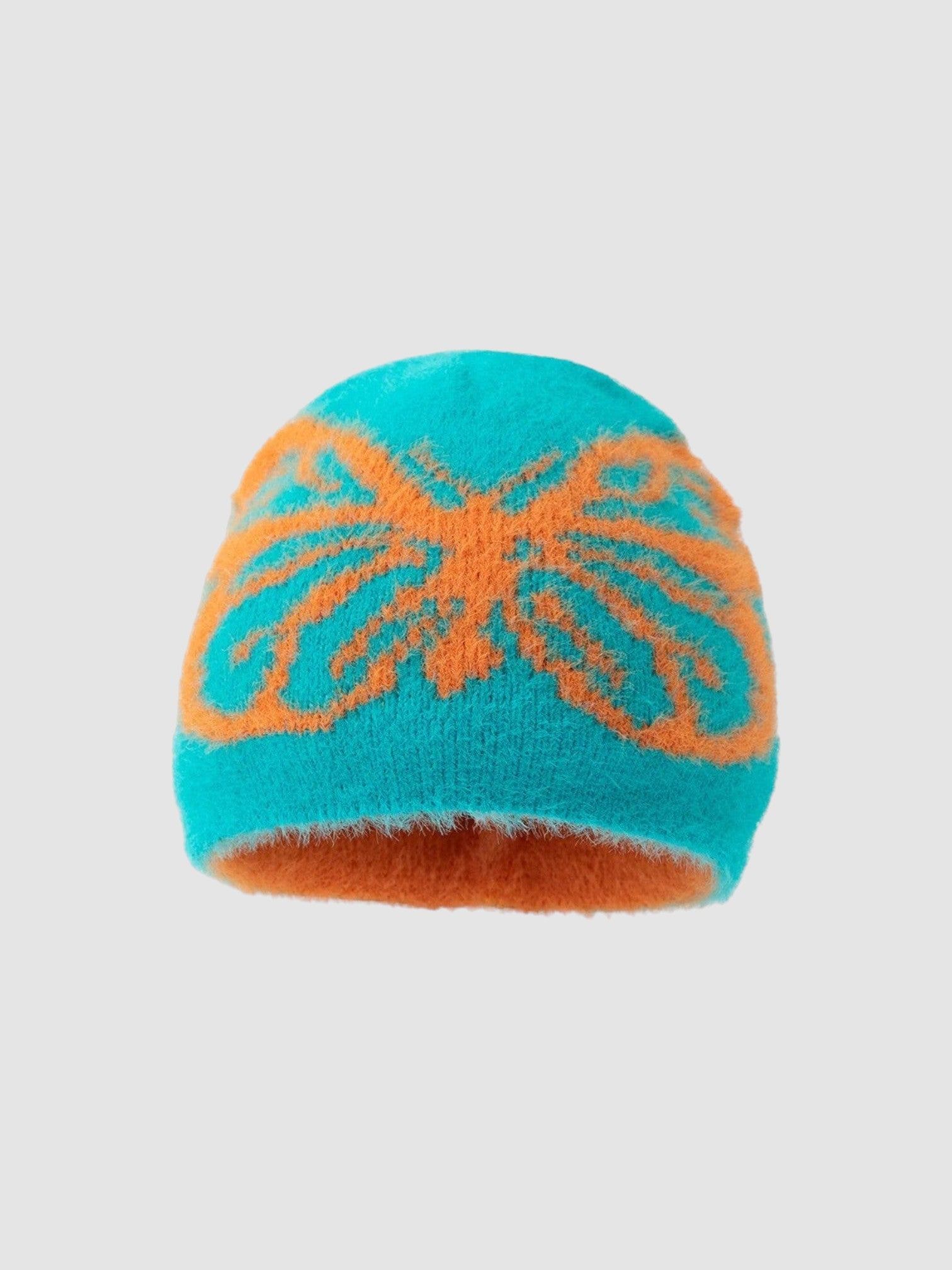 Y2K AVENUE fuzzy knit beanie in teal and orange with a prominent butterfly pattern for a casual winter look