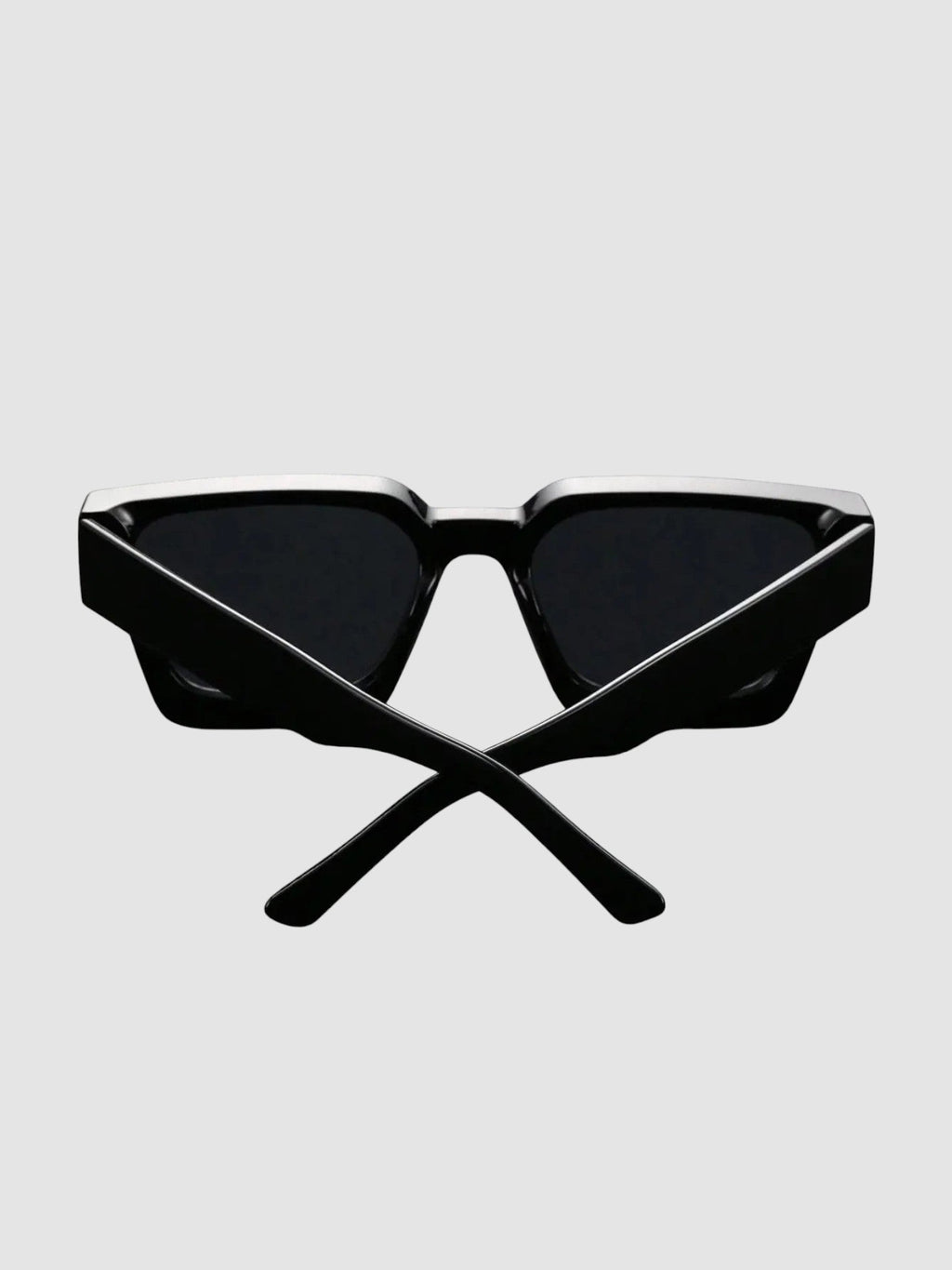 Y2K Avenue thick black rectangular sunglasses with wide temples and UV400 polycarbonate lenses on a dark surface