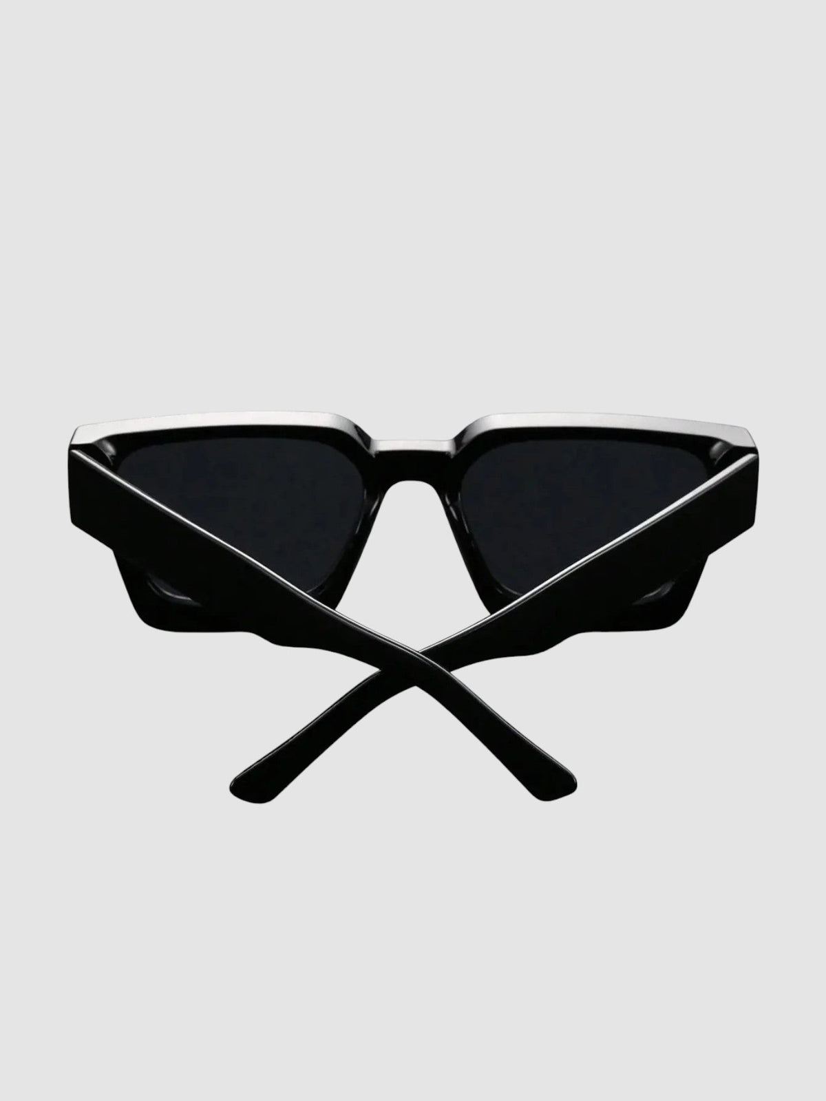 Y2K Avenue thick black rectangular sunglasses with wide temples and UV400 polycarbonate lenses on a dark surface