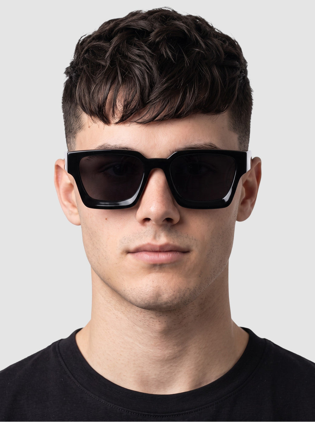 Y2K Avenue thick rectangular black sunglasses with UV400 polycarbonate lenses worn by a man against a white background