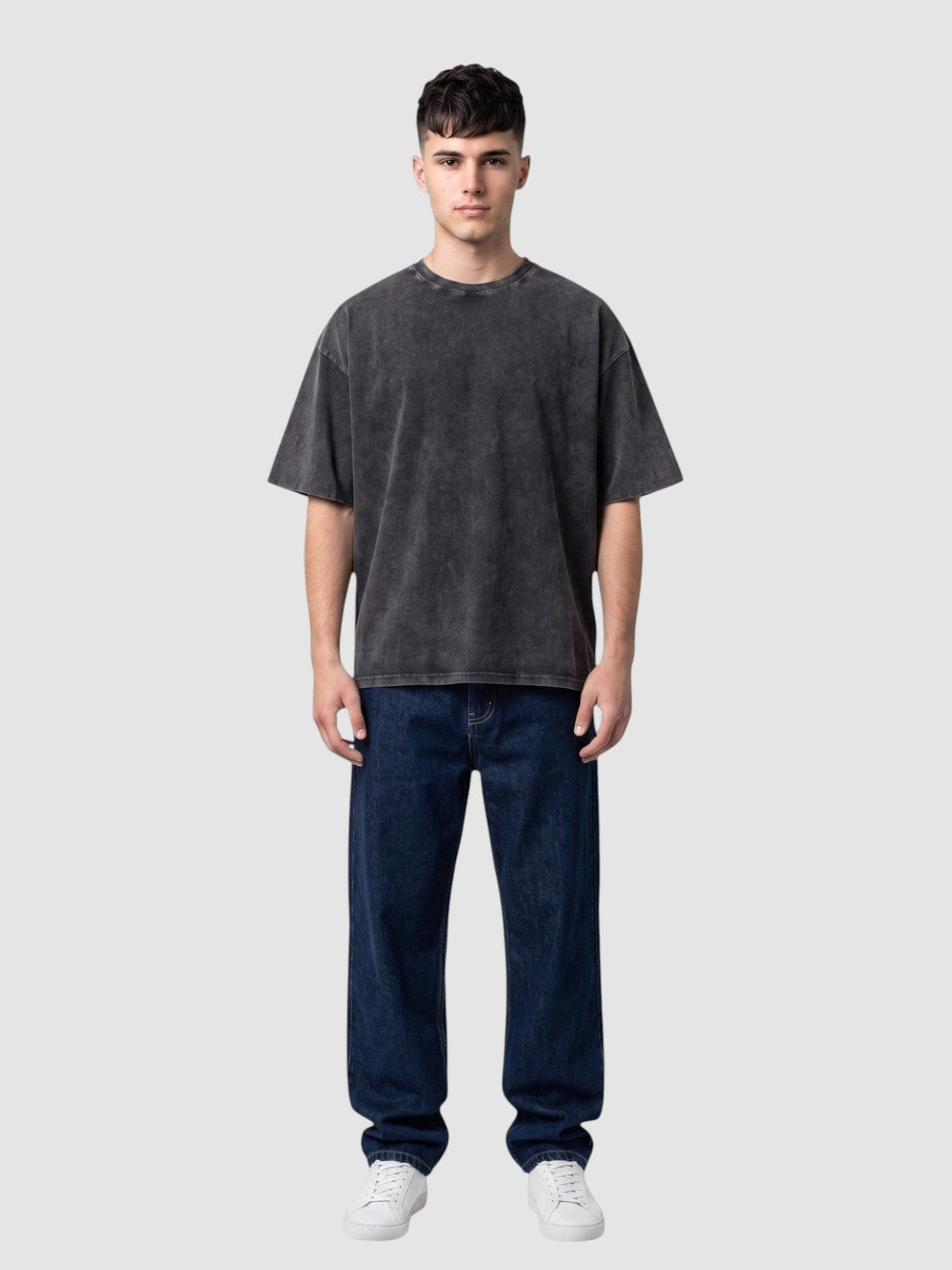 Y2K Avenue vintage washed black cotton t-shirt with a relaxed fit, crew neck, and short sleeves on a male model.