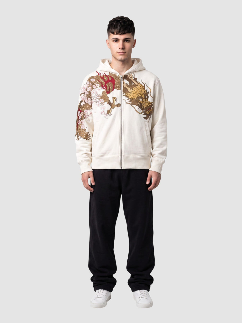 Y2K Avenue white zip-up hoodie featuring a gold and red dragon and cherry blossom print, worn by a male model.