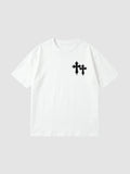 Y2K Avenue white oversized cotton t-shirt with black gothic cross graphic on the chest and ribbed crew neck.
