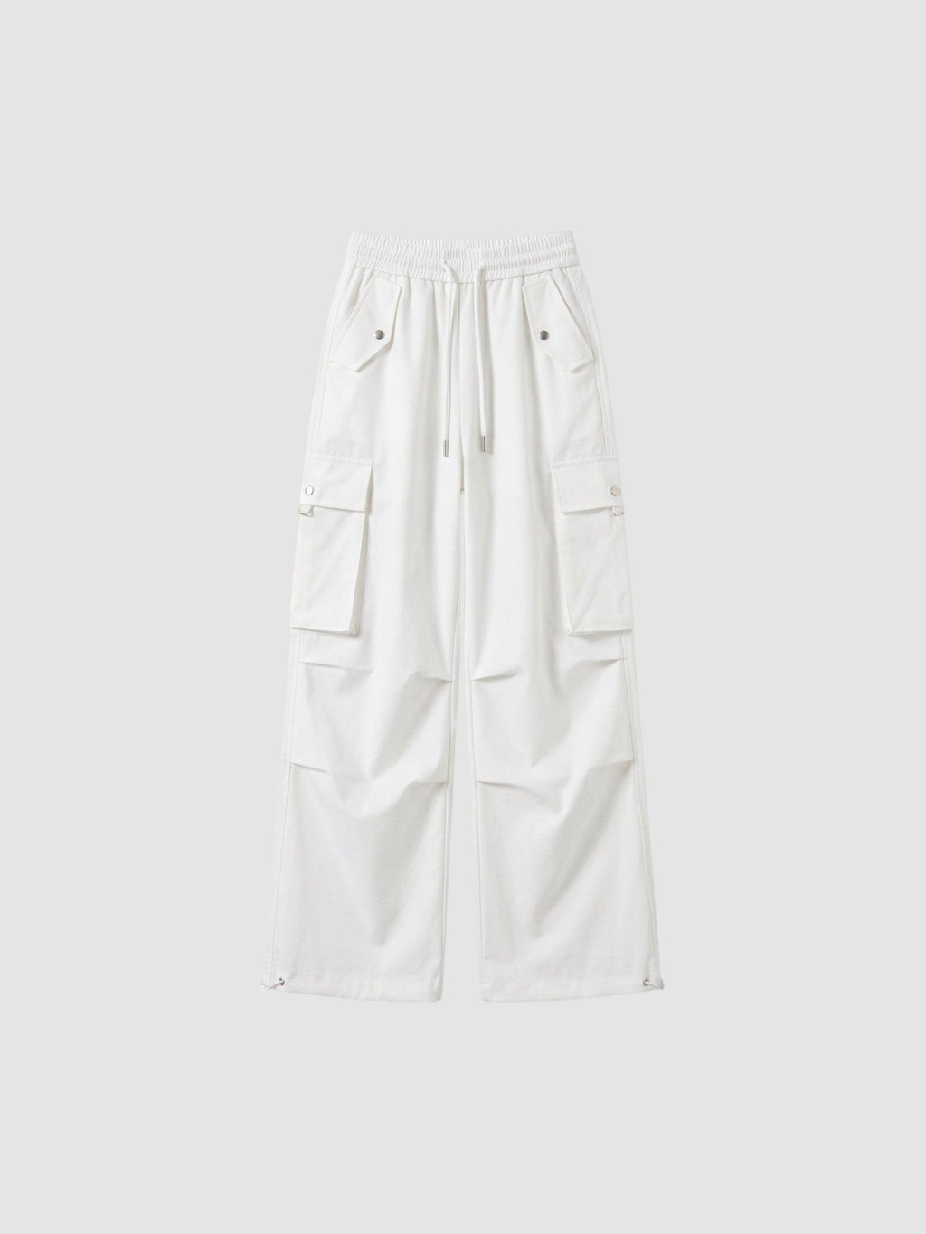 Y2K Avenue white high-waisted parachute cargo pants in matte poplin with multiple pockets and adjustable leg cords.