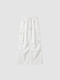 Y2K Avenue white high-waisted parachute cargo pants in matte poplin with multiple pockets and adjustable leg cords.