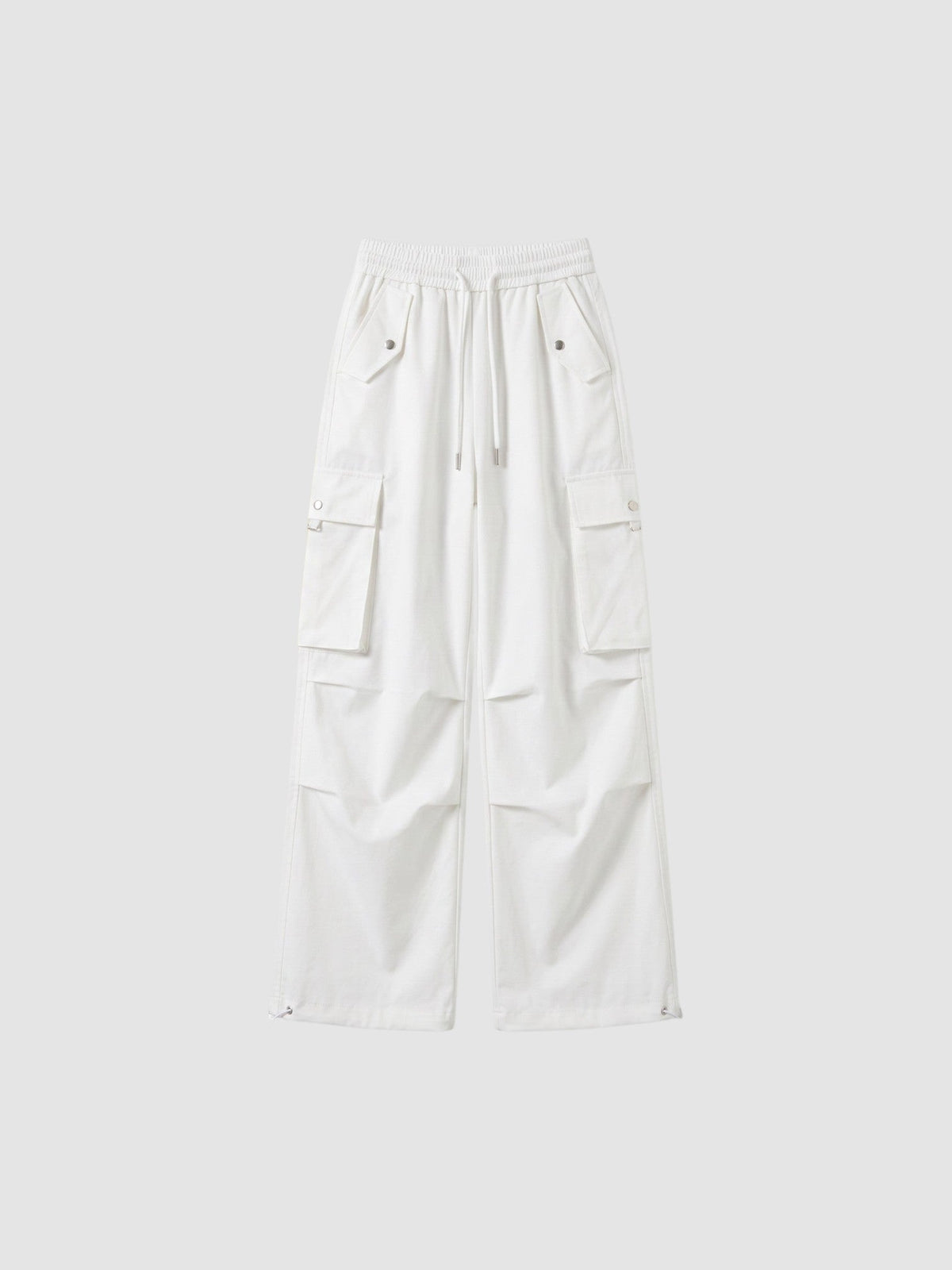 Y2K Avenue white high-waisted parachute cargo pants in matte poplin with multiple pockets and adjustable leg cords.