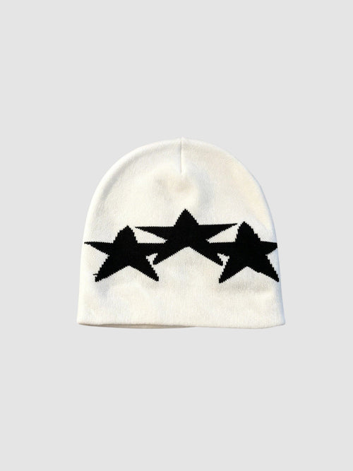 Y2K Avenue white acrylic beanie featuring three overlapping black star motifs in a graphic Y2K style
