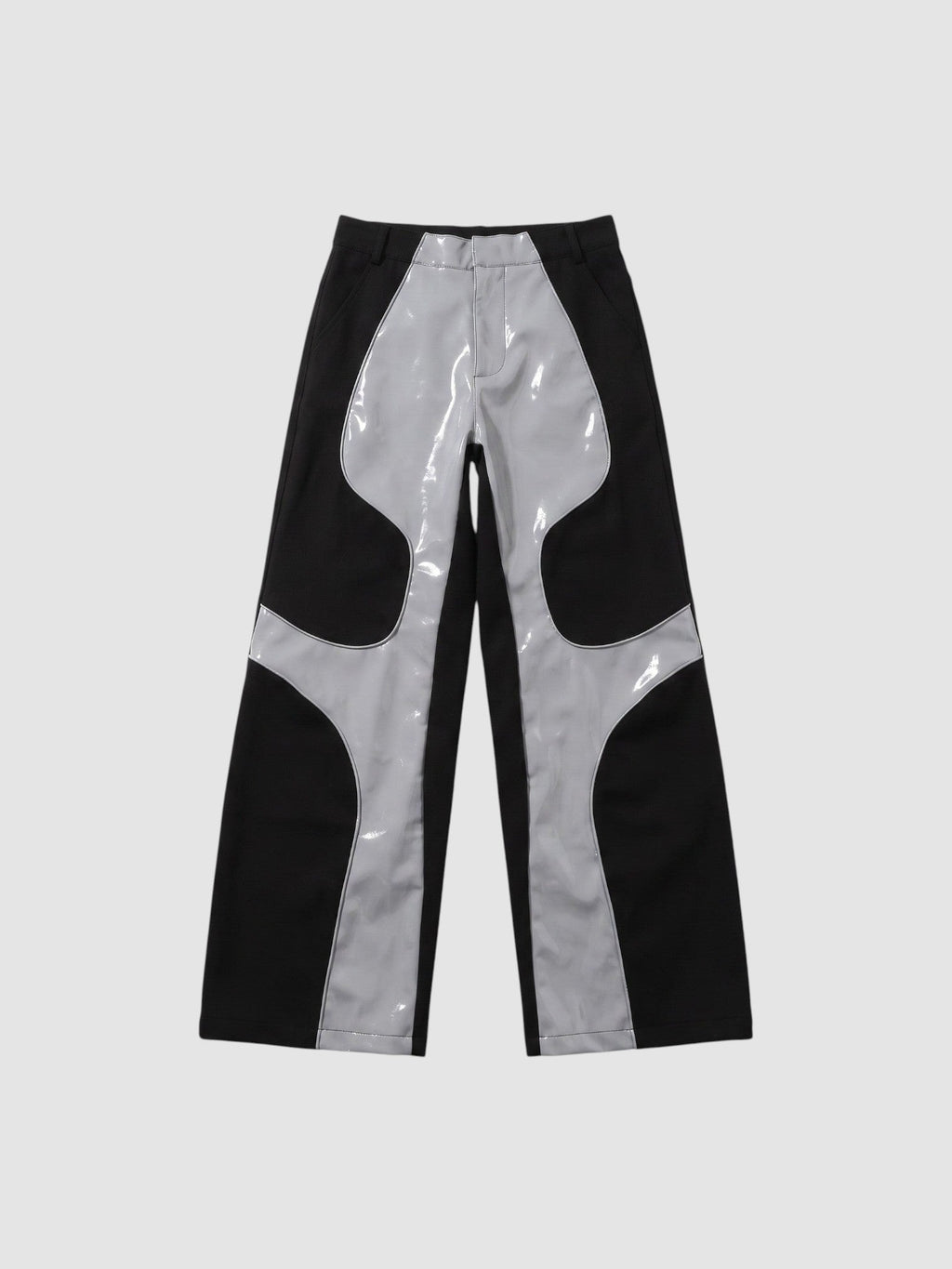 Y2K AVENUE wide leg faux leather trousers in black and glossy light grey with wavy wave-cut panel detailing.