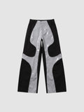 Y2K AVENUE wide leg faux leather trousers in black and glossy light grey with wavy wave-cut panel detailing.