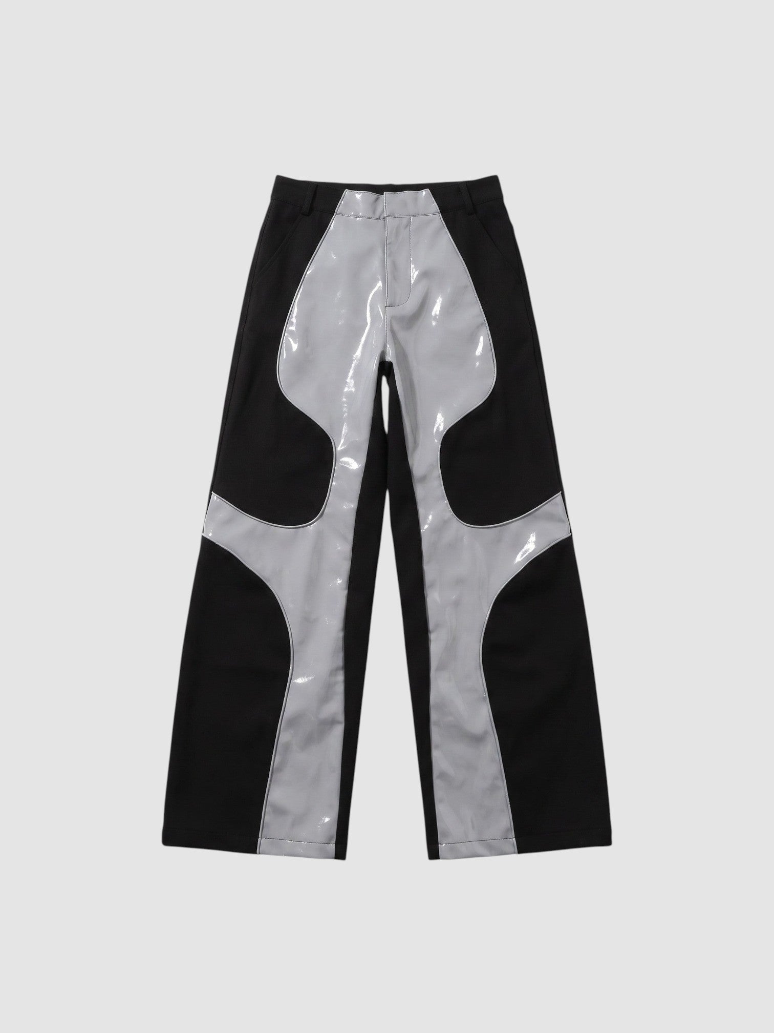 Y2K AVENUE wide leg faux leather trousers in black and glossy light grey with wavy wave-cut panel detailing.